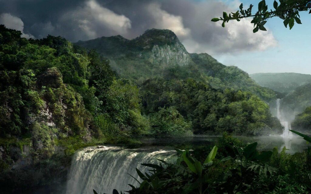 Dramatic jungle waterfall cascading through dense greenery and towering mountains under moody sky Wallpaper