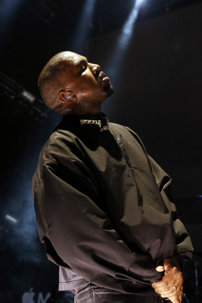 Dramatic Kanye West Wallpaper: Saint Pablo Tour Spotlight Intensity