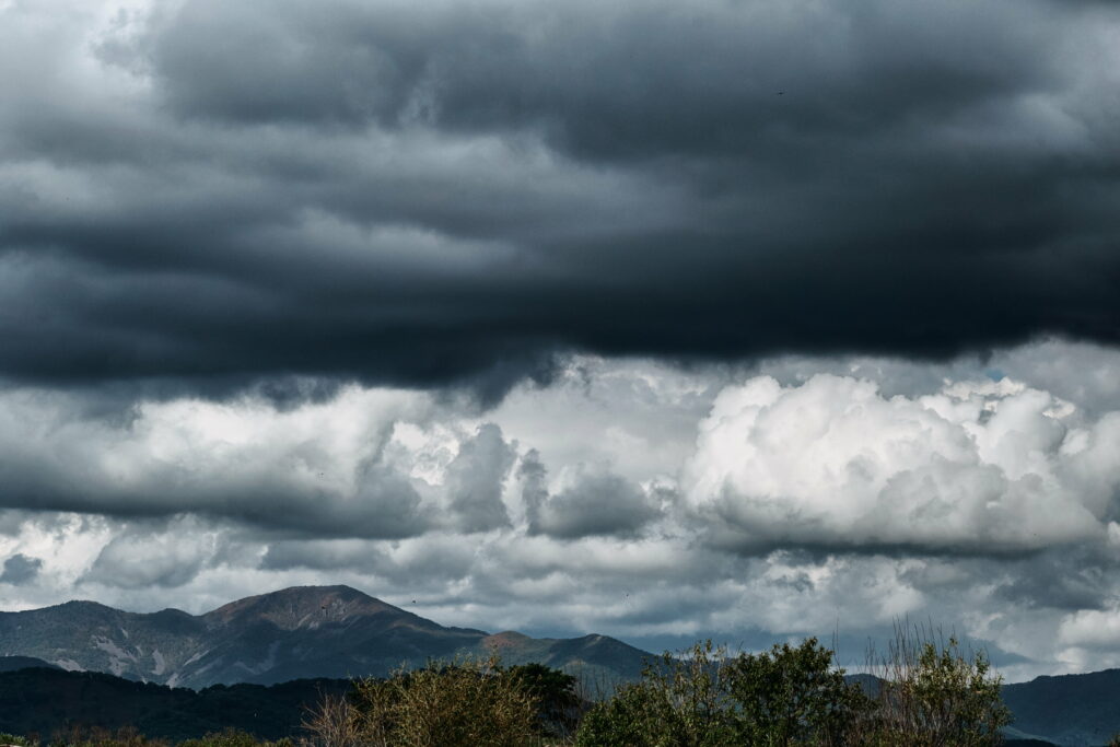 Dramatic Mountain Landscape HD Wallpaper with Ominous Clouds