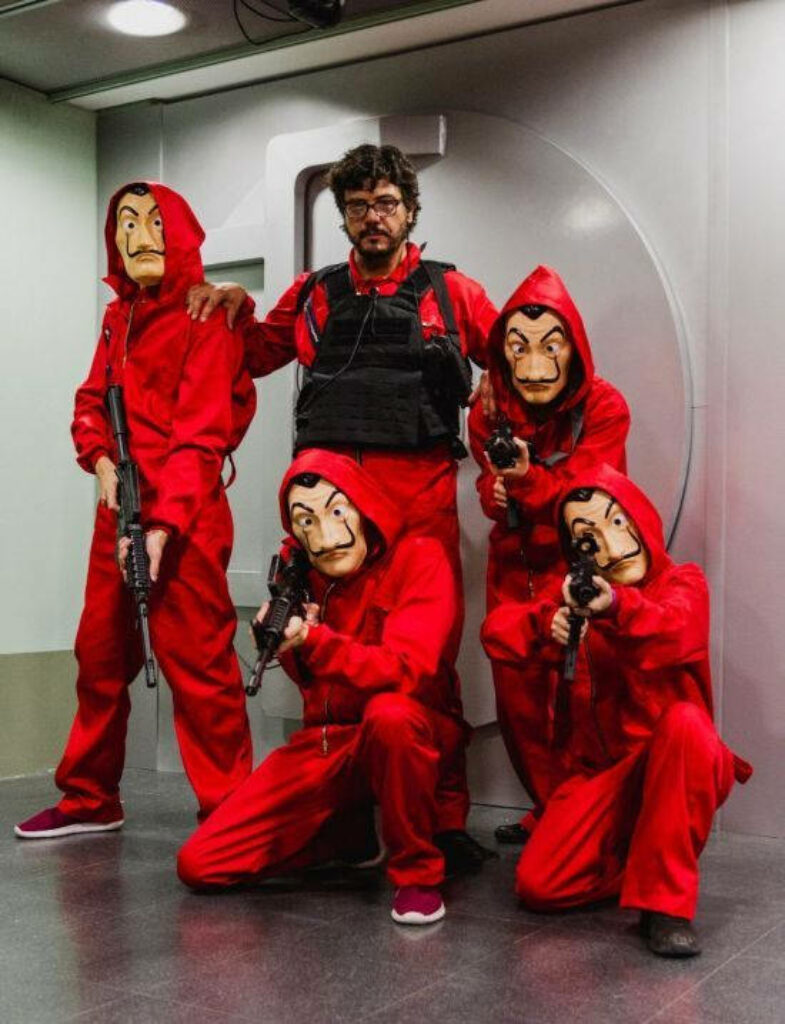 Bold Ensemble: The Money Heist Mastermind and His Infiltrators Unveiled Wallpaper
