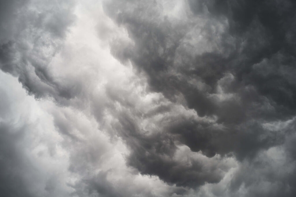 Monochrome Sky Wallpaper: Dramatic Swirling Clouds & Mystery Background