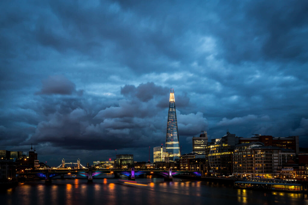 Stormy Sky Over London: Vibrant Shard & Skyline Wallpaper Background
