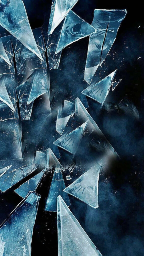 Shattered blue glass shards with realistic reflections on dark smoky background wallpaper design
