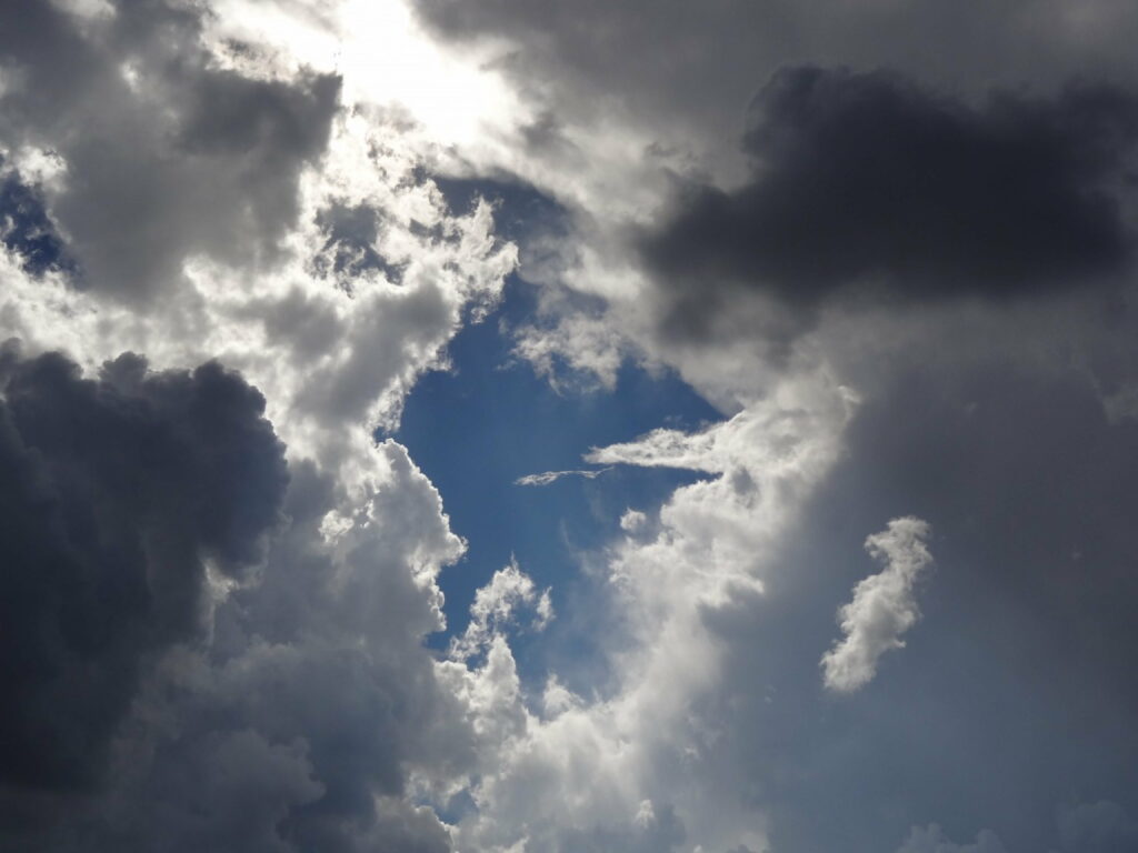 Stunning HD Wallpaper: Dramatic Sky with Dark Clouds & Blue Patches