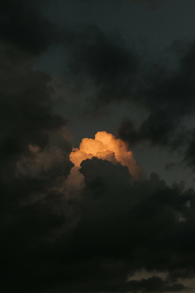 Dramatic Sky Wallpaper: Ominous Clouds & Golden Sunset Background