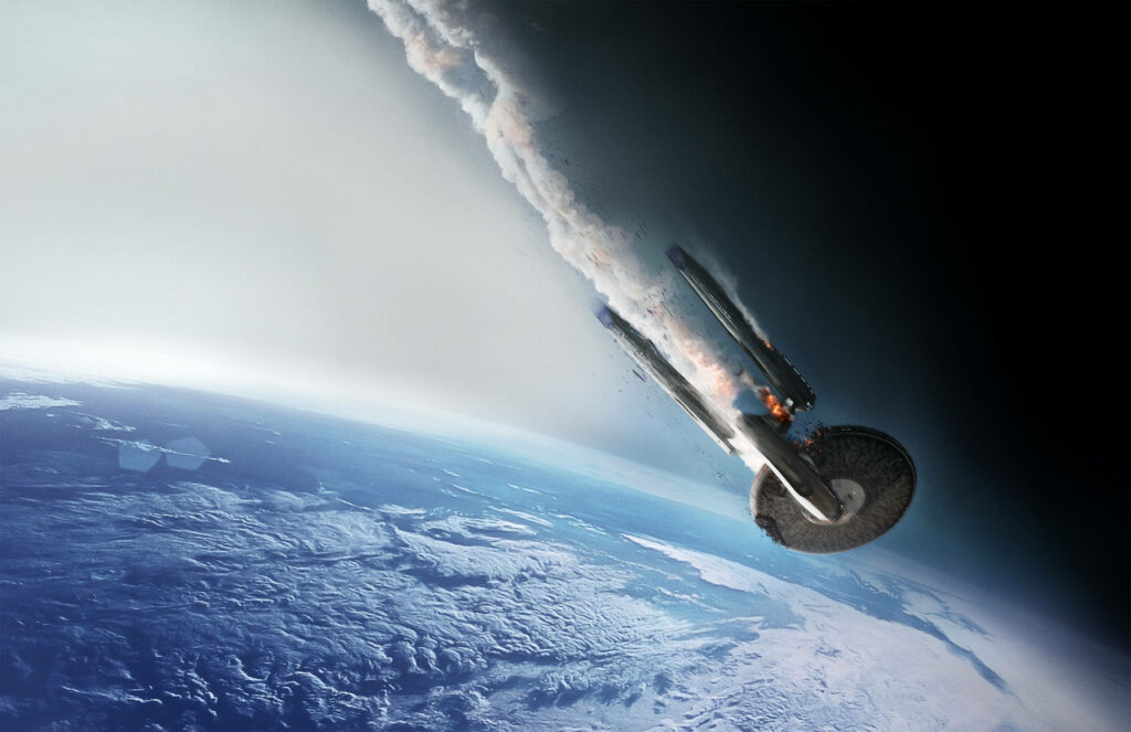 Dramatic Star Trek Ship Wallpaper: Space Plunge with Smoke & Fire