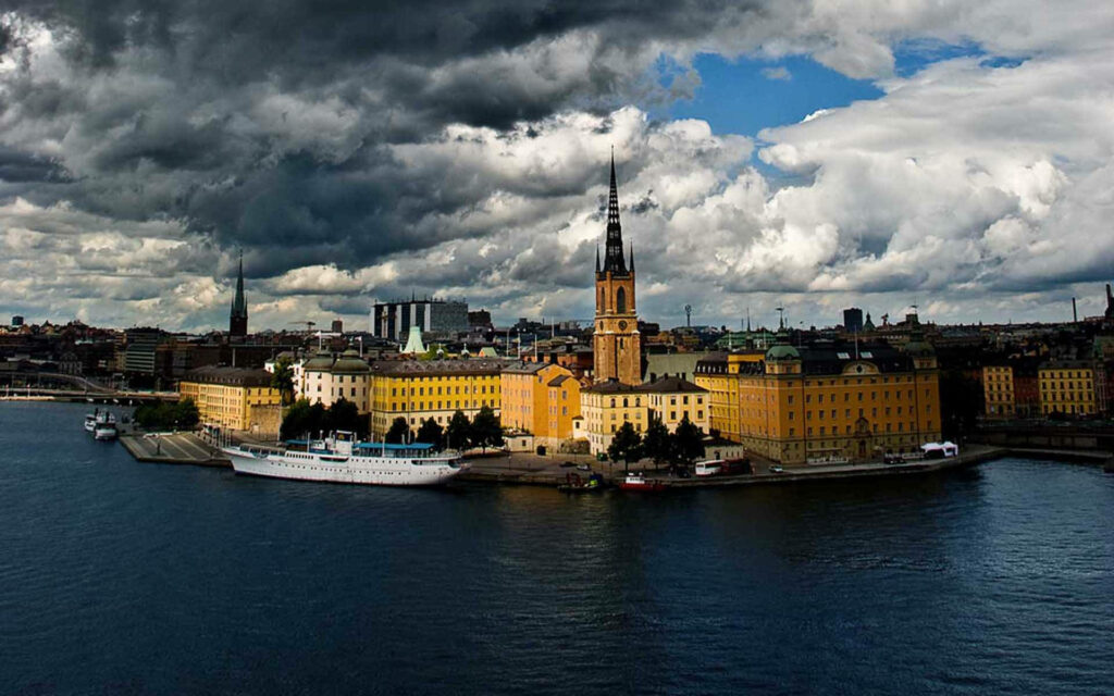 Vibrant Stockholm Skyline Wallpaper: Dark Skies & Colorful Architecture