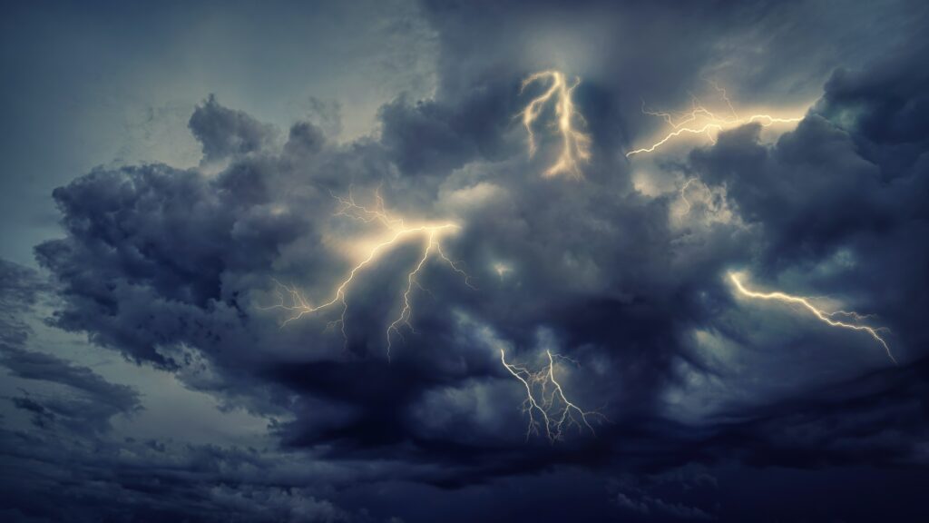 Dramatic storm wallpaper dark swirling clouds intense lightning night sky photorealistic background