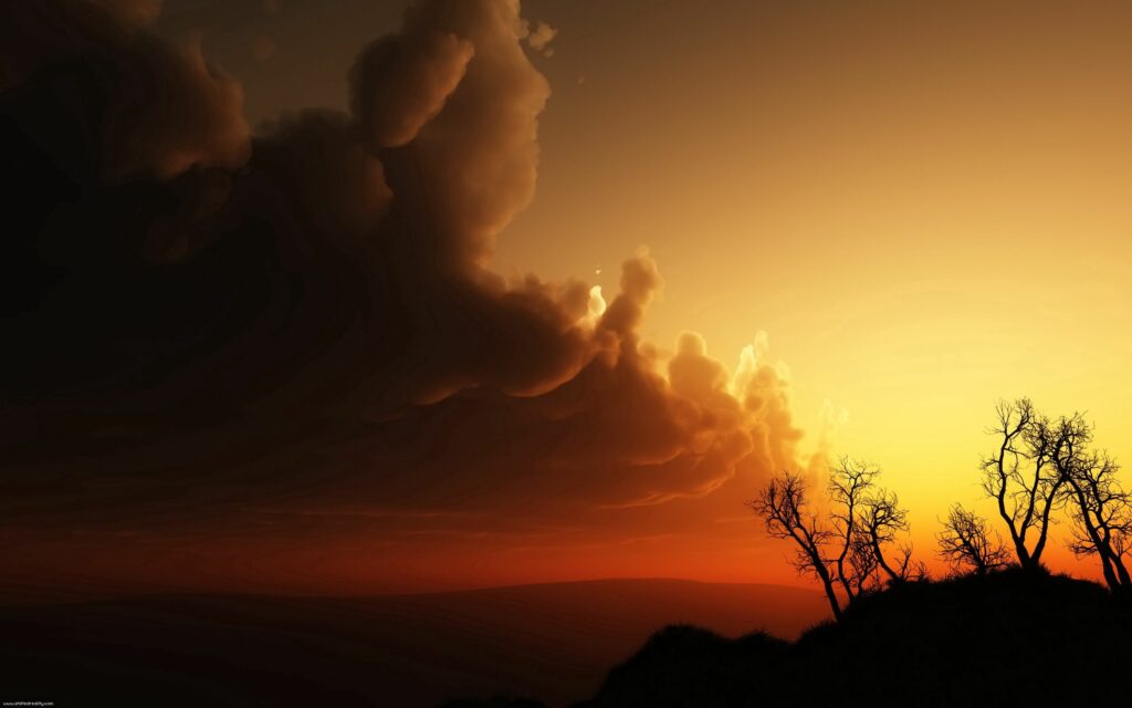 Dramatic sunset with voluminous clouds and silhouetted bare trees over rolling hills wallpaper