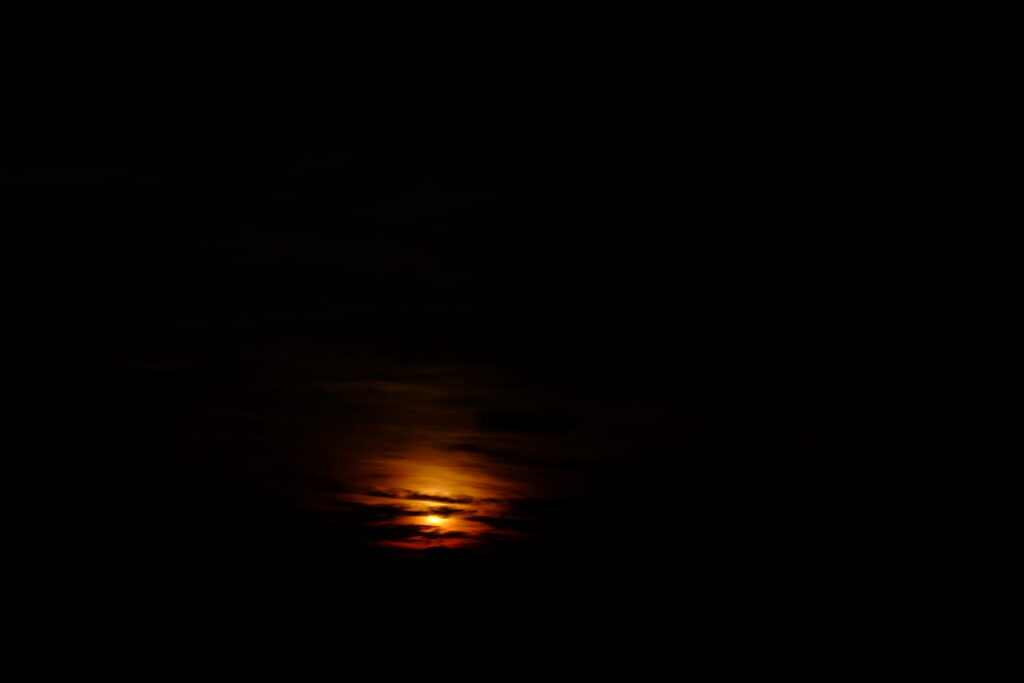 Dramatic Sunset Wallpaper: Moody Atmosphere with Dark Clouds