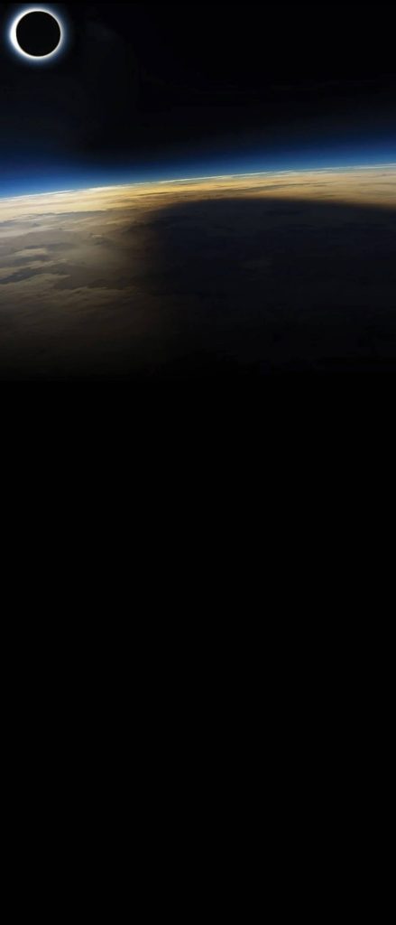 Total solar eclipse from space 4K wallpaper moon shadow masking camera cutout smartphone background