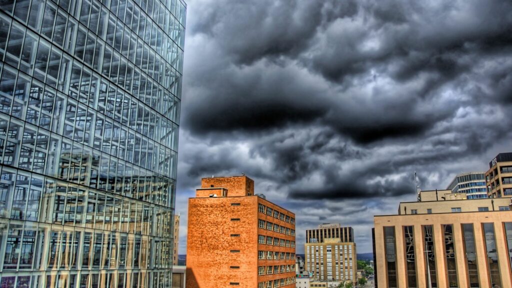Urban Skyscraper Wallpaper: HDR Cityscape under Brooding Sky