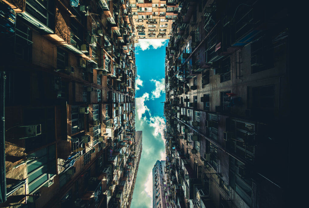 Urban Skyward: Dramatic Wallpaper of Tall Buildings & Blue Sky