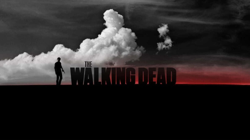 Walking Dead Silhouette Wallpaper: Eerie Clouds & Red Horizon