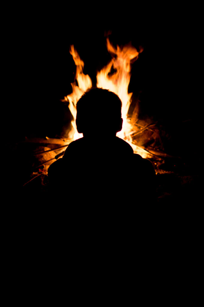 Dark Silhouette Man by Roaring Fire - Dramatic Wallpaper Background