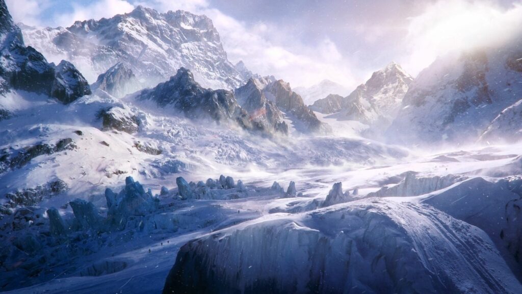 Snow-covered mountain peaks and icy cliffs in a swirling winter blizzard alpine landscape wallpaper