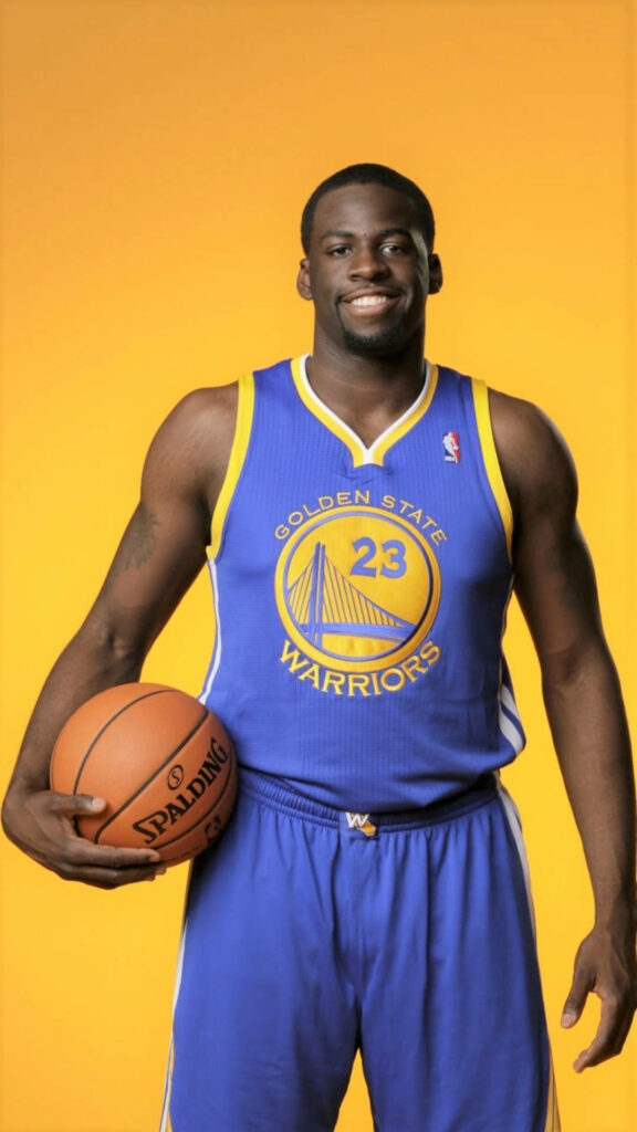 Draymond Green in 2012 Warriors rookie jersey holding basketball vibrant yellow background portrait Wallpaper