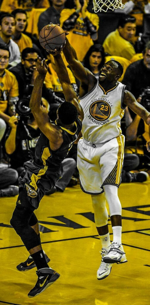 Draymond Green blocking shot for Golden State Warriors intense NBA game vibrant wallpaper
