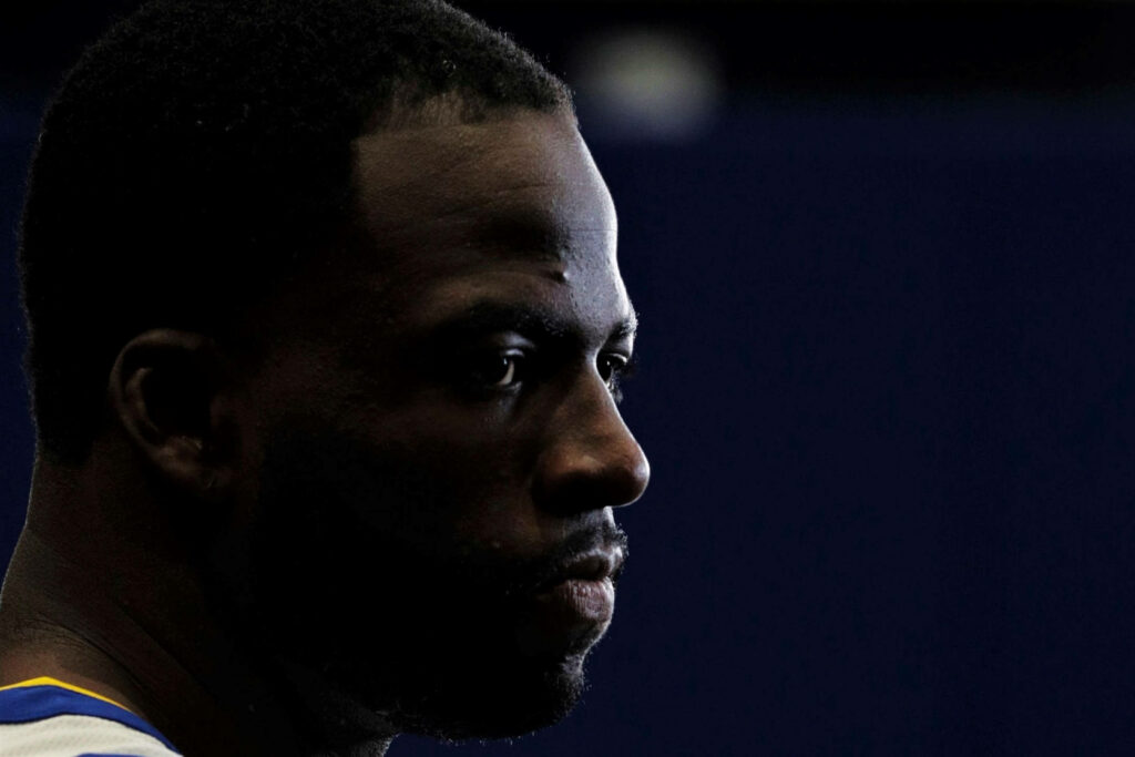 Draymond Green intense side profile wallpaper with dramatic lighting and focused expression