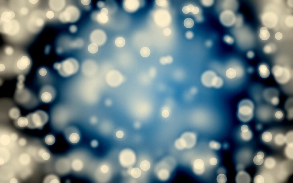 Dreamy Abstract Wallpaper: Soft Glowing Bokeh on Blue Background