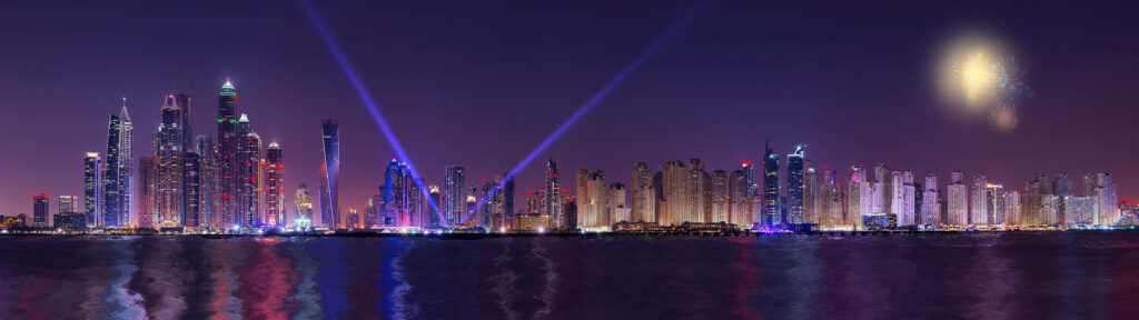 Dazzling Nighttime Spectacle: Vibrant Dubai Skyline Illuminated in Mesmerizing City Lights - Breathtaking 4k Ultra Widescreen Wallpaper