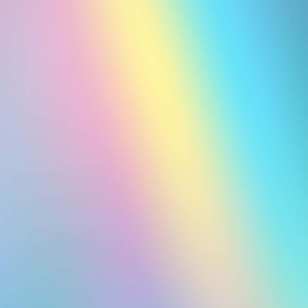 Dreamy pastel rainbow background with smooth pink yellow and blue gradient for wallpaper