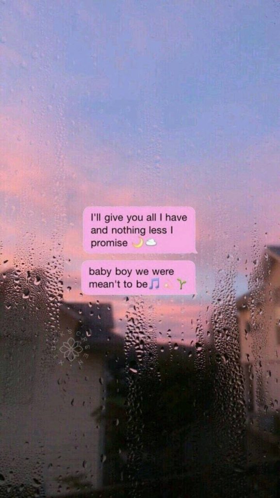 Dreamy pastel sunset rain-streaked car window with romantic Tumblr style text wallpaper background