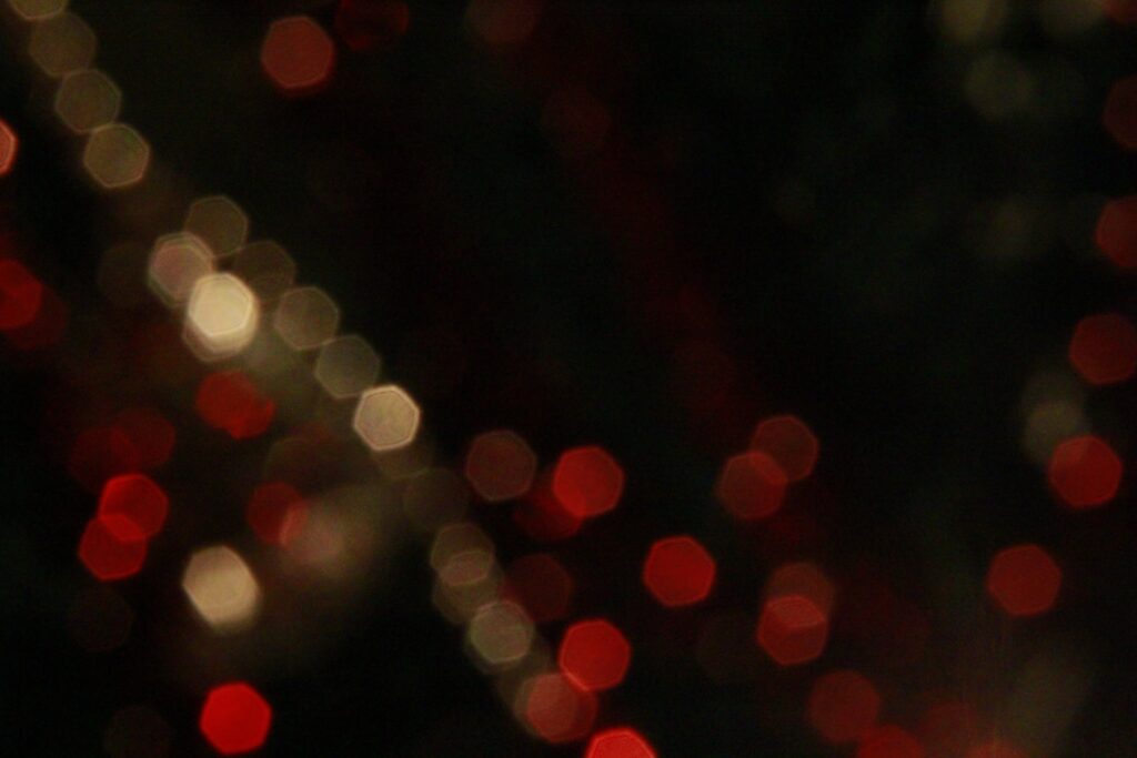 Abstract Bokeh Wallpaper: Red & White Lights on Dark Background