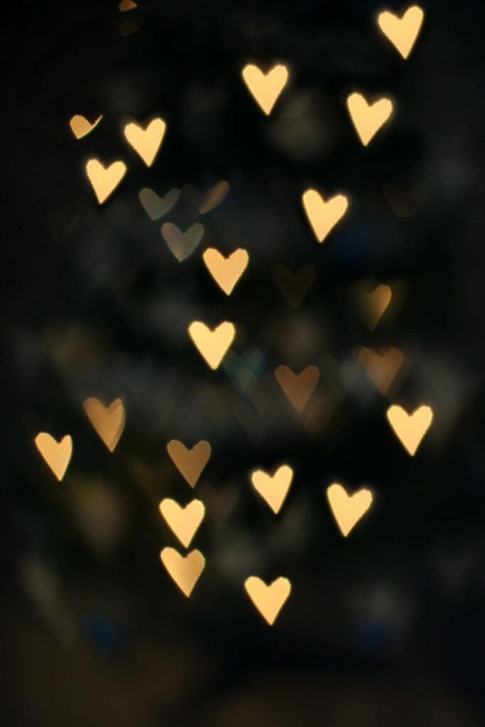 Romantic Golden Heart-Shaped Bokeh Wallpaper Background