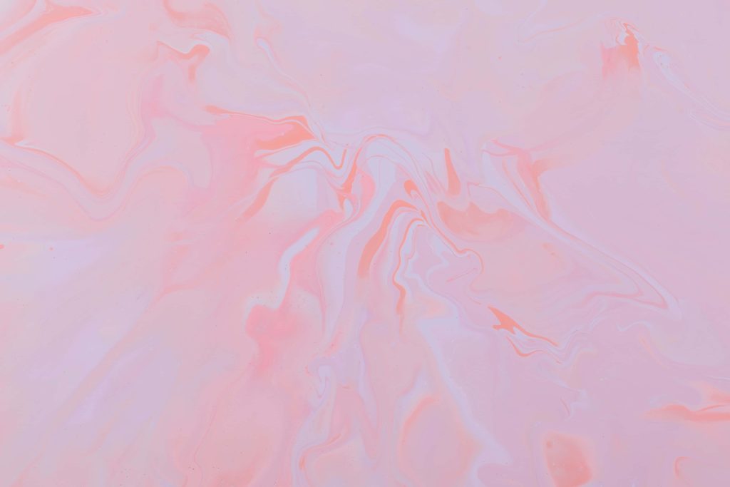 Abstract fluid art soft pink wallpaper with pastel coral swirls and marbled design background