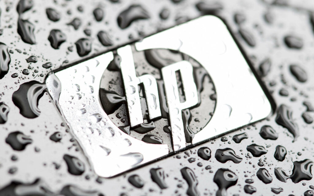 Drenched in Elegance: Beautified Hp Laptop Logo Captured in Close-up Wallpaper