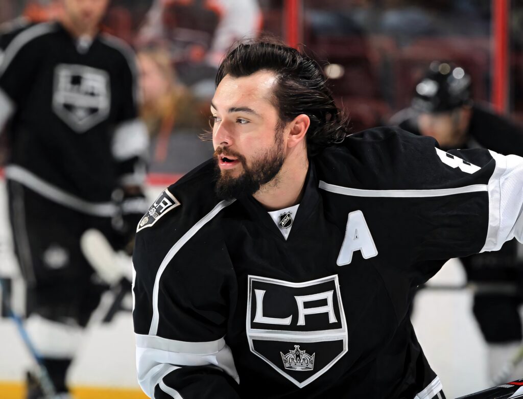 Drew Doughty LA Kings focused hockey player without helmet sharp ice rink background wallpaper