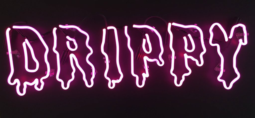 Pink neon DRIPPY sign wallpaper with liquid melting font on black background urban vibe