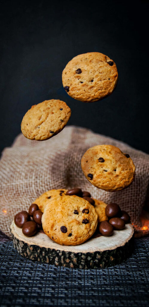 Artful Studio Capture of Wood Log Plate Hosting Motion Shot Cookies Wallpaper
