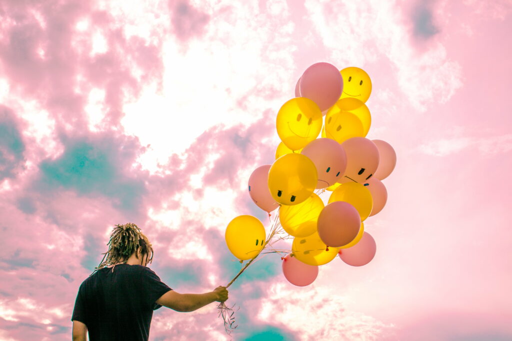 Bittersweet Emotions in the Skies: A Vibrant 4K Wallpaper Capturing a Boy's Balloon Journey
