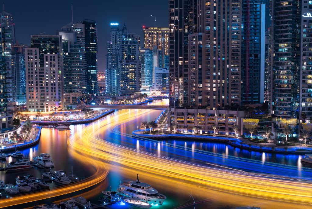 Dubai Marina night skyline with long-exposure light trails and illuminated skyscrapers wallpaper
