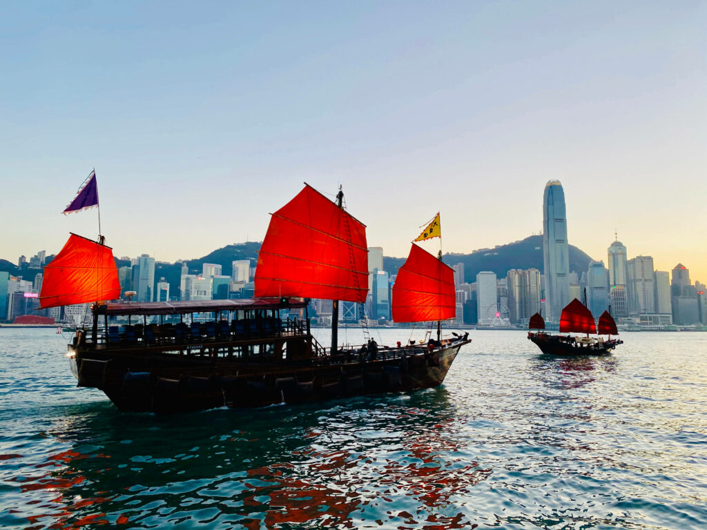 Stunning Hong Kong Harbor Wallpaper: Red-Sailed Dukling Boats