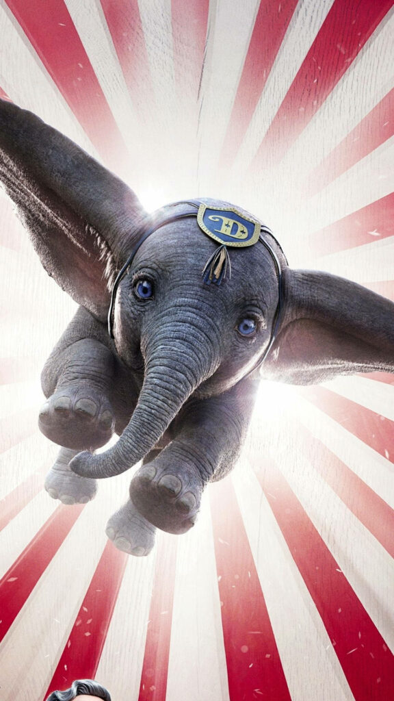 Dumbo flying with large ears over red and white circus stripes live action wallpaper background