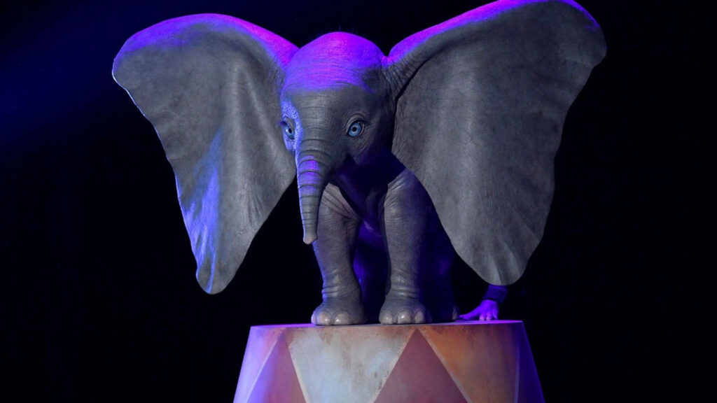 Dumbo elephant on circus pedestal with dramatic blue purple lighting detailed realistic art Wallpaper