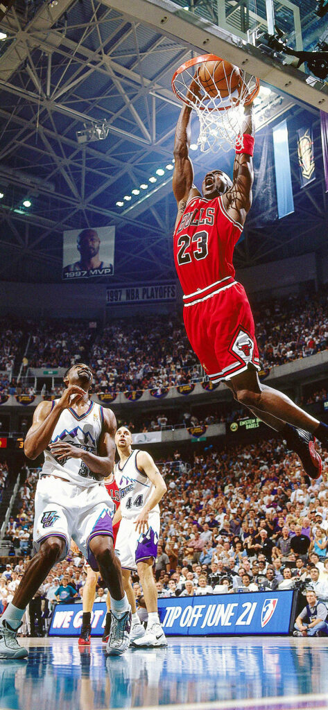 Dunkmaster Jordan Rising Above the Jazz: 1998 NBA Finals Clash - Elevate Your iPhone with Sports Spirit Wallpaper
