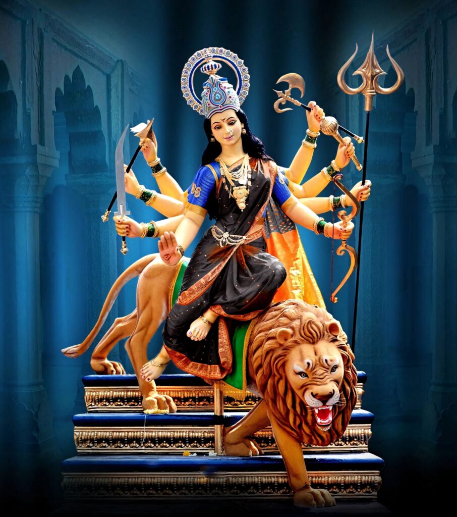 Durga Devi sculpture riding lion Dawon with multiple arms and weapons in vibrant wallpaper background