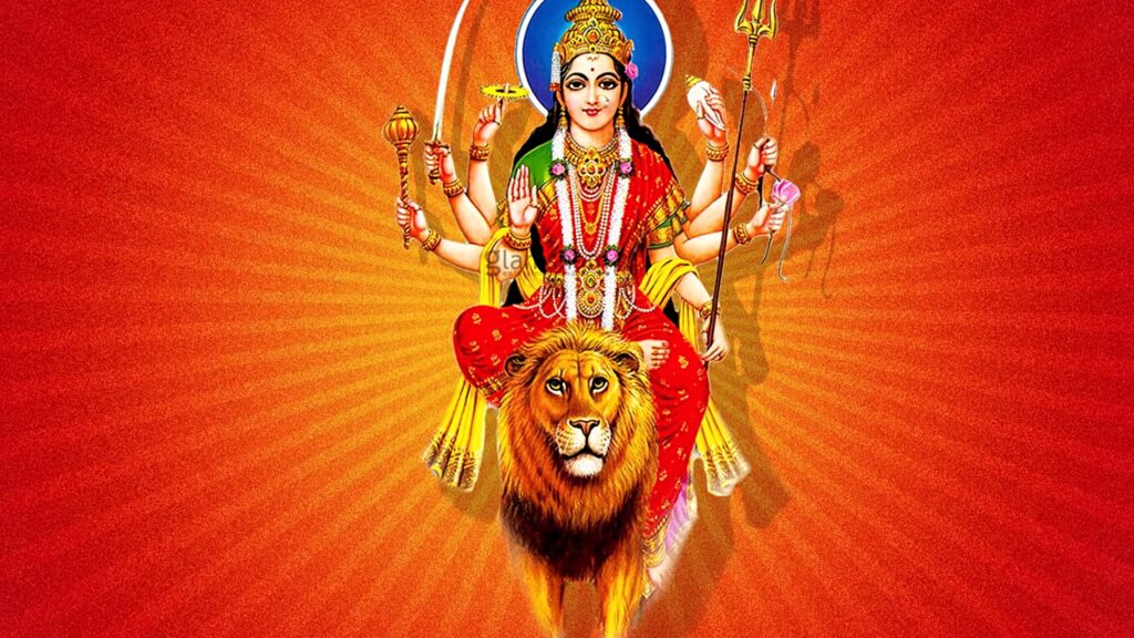 Durga Devi in traditional attire with multiple arms on lion Dawon vibrant orange gold wallpaper