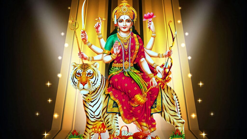 Durga Devi on tiger in red saree holding weapons and flowers radiant golden digital art wallpaper