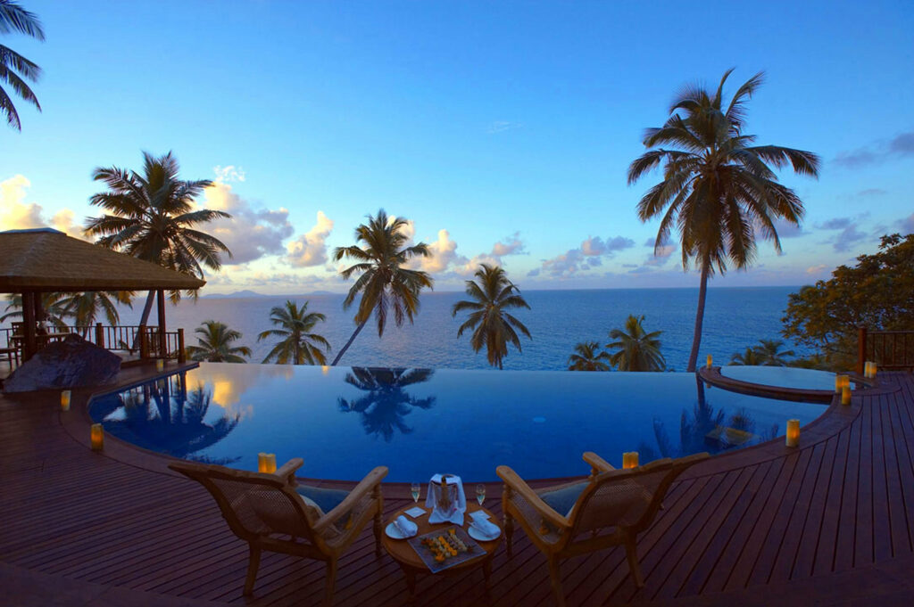 Serenity at Sunset: Mesmerizing Ocean View from Fregate Island Resort Infinity Pool Wallpaper
