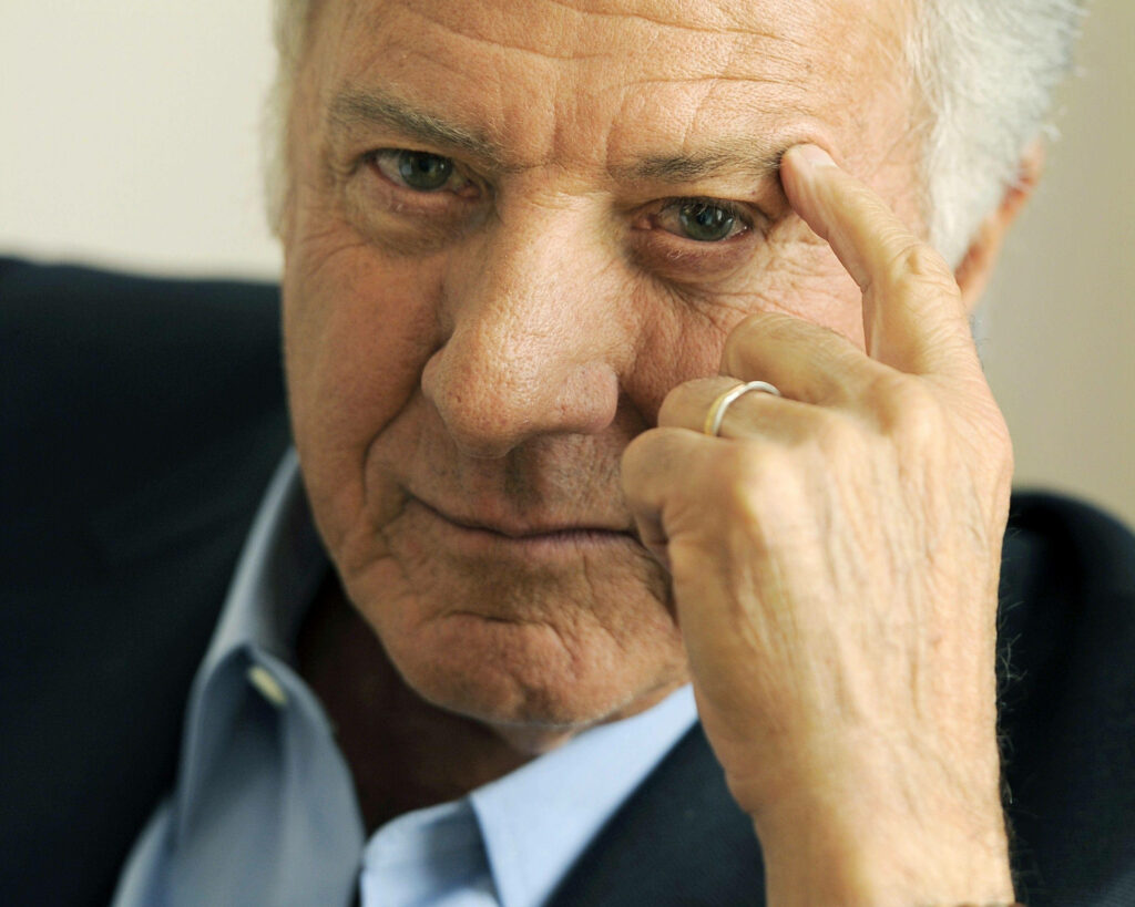 Close-up portrait of veteran actor Dustin Hoffman with soft natural tones and thoughtful expression Wallpaper