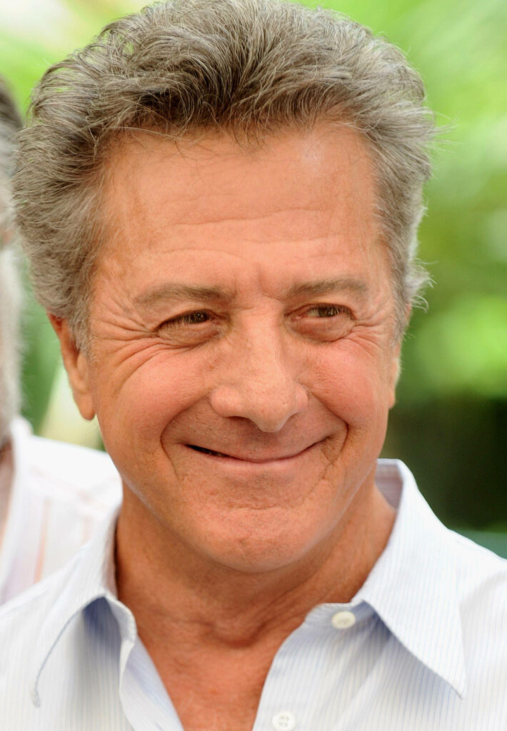 Dustin Hoffman portrait with silver hair warm smile soft lighting blurred background wallpaper