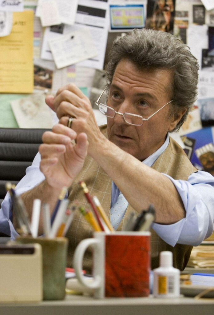 Dustin Hoffman as Professor Jules Hilbert in a cluttered academic office with papers and pens Wallpaper