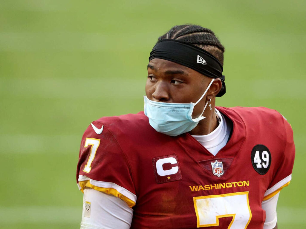 Dwayne Haskins Washington Football Team number 7 maroon gold jersey black headband blue mask Wallpaper