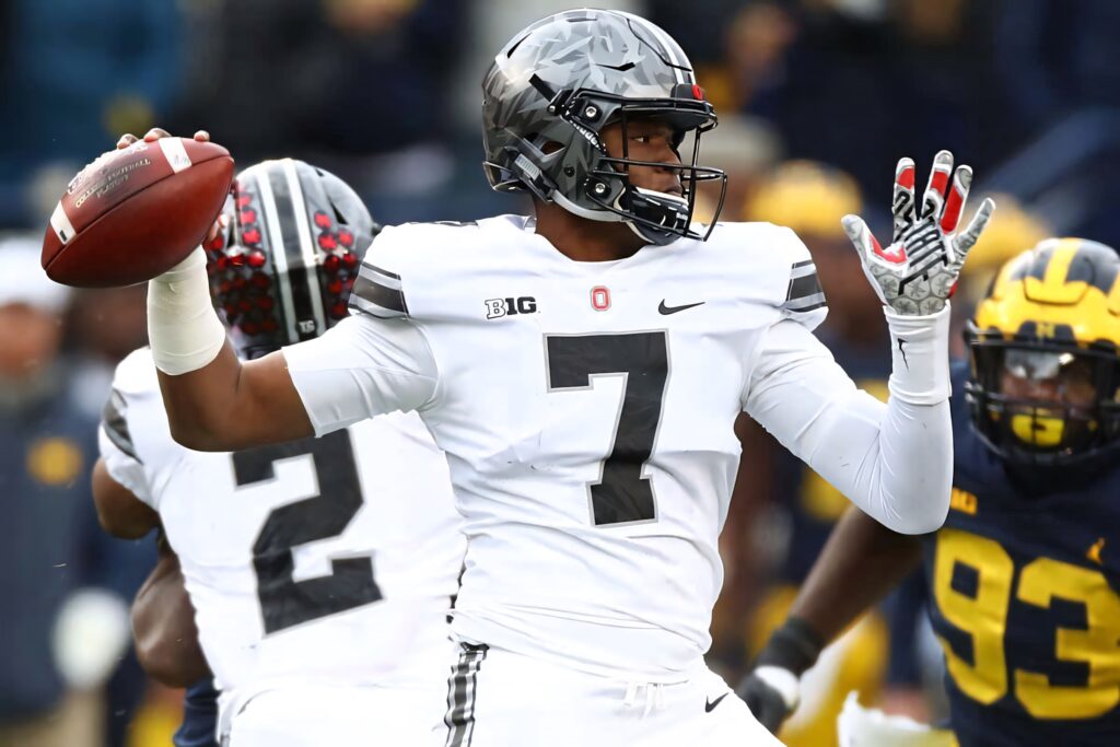 Dwayne Haskins Washington Football Team quarterback number 7 poised to throw football on field Wallpaper