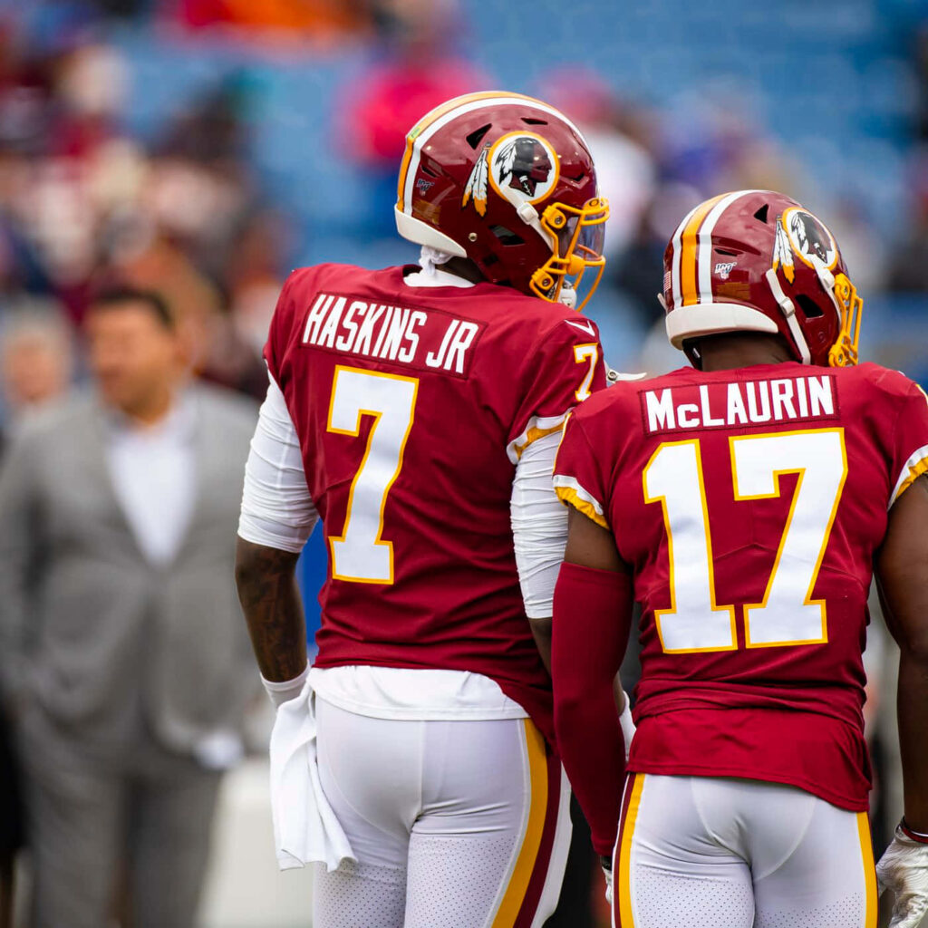 Dwayne Haskins and Terry McLaurin in burgundy gold Washington Redskins NFL uniforms on field Wallpaper
